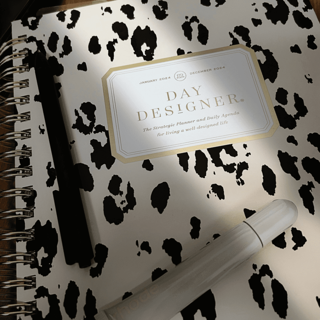image of leopard planner with black pen and rhode gloss